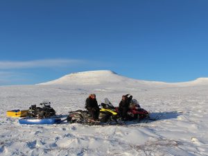 Community members travel by snowmobile to gather camera trap data as part of the Divii (Dall’s Sheep) Project. Photo by Édouard Bélanger (GRRB)